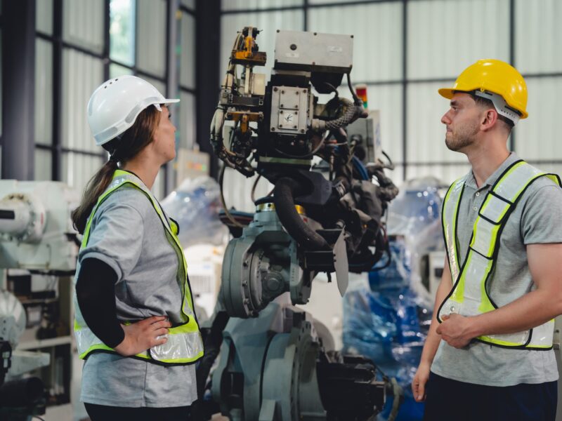 Technician,Engineer,In,Factory,,Maintaining,And,Repairing,Robotic,Arms,Machinery,